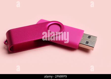 USB flash drive on pink background Stock Photo