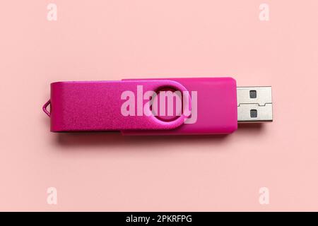 USB flash drive on pink background Stock Photo