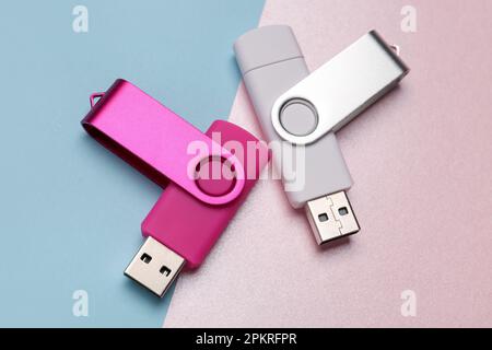Two USB flash drives on color background Stock Photo