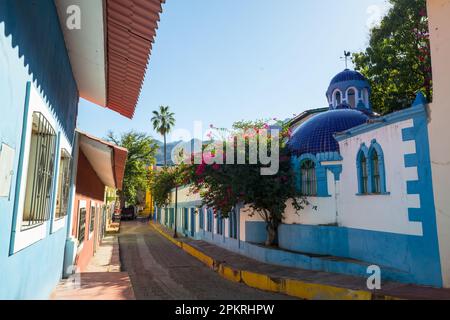 Amazing colorful buildings in pueblo magico Batopilas in Barrancas del Cobre mountains, Mexico Stock Photo