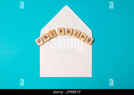 Email phishing, blank envelope and letters on blue background Stock Photo