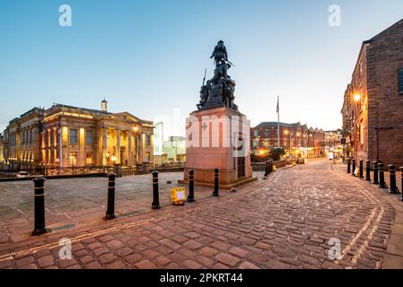 Illuminated view of Town hall in a Yorkshire Street with War memorial Sculpture in Oldham City, UK Stock Photo