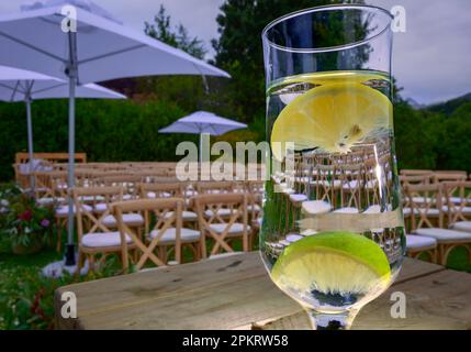 A glass reflects a wedding reflection held at the Tokara Wine Estate. Stock Photo