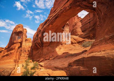 Entrada sandstone of Tower Arch with blue sky in Arches National Park in Moab Utah Stock Photo