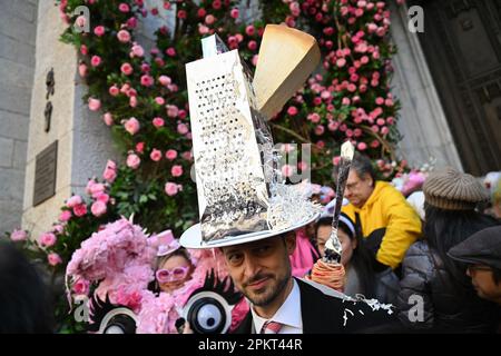 People attend the annual Easter Parade and Bonnet Festival along Fifth Avenue on Easter Sunday on April 9, 2023 in New York City. Stock Photo