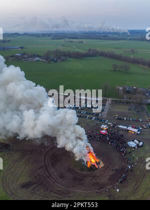 DIJKERHOEK - Drone photo of the Easter fire in the hamlet of Dijkerhoek in the municipality of Rijssen - Holten with in the background the plume of smoke from the Easter fire of the hamlet of Espelo in the area. A number of Easter fires could not continue or had to be changed due to nitrogen emissions. ANP VINCENT JANNINK netherlands out - belgium out Stock Photo