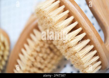 kitchen brushes hang in supermarket Stock Photo