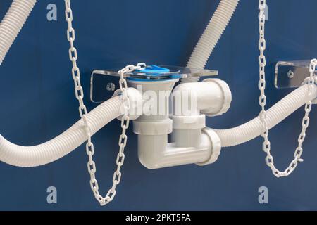 Plumbing sanitary white plastic sewer pipes siphons overflows for bathroom and sink. Stock Photo