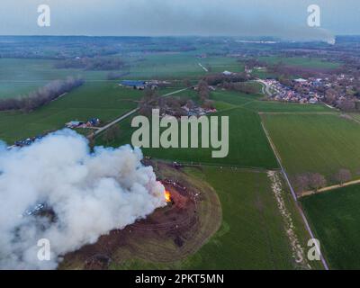 DIJKERHOEK - Drone photo of the Easter fire in the hamlet of Dijkerhoek in the municipality of Rijssen - Holten with the plume of smoke from the Easter fire of the neighborhood of Holterbroek in the background. A number of Easter fires could not continue or have to change due to nitrogen emissions. ANP VINCENT JANNINK netherlands out - belgium out Stock Photo