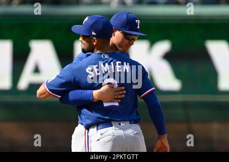 Texas Rangers' Corey Seager, left, Jonah Heim, center, and Marcus Semien,  right, celebrate their win in a baseball game against the Minnesota Twins,  Friday, July 8, 2022, in Arlington, Texas. (AP Photo/Tony