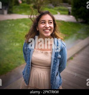 Asian Teen Walking on Misty Walkway | De Young Museum Gardens | Female | Short Dress Denim Jacket Stock Photo