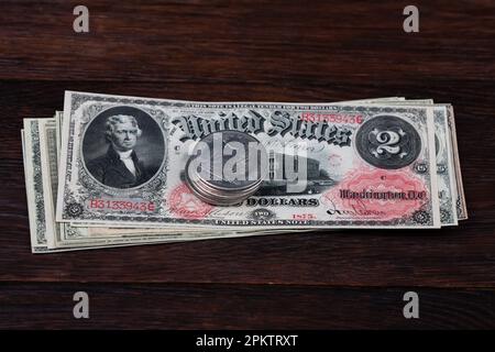 Old west period US banknotes and silver certificates with silver dollar coins Stock Photo