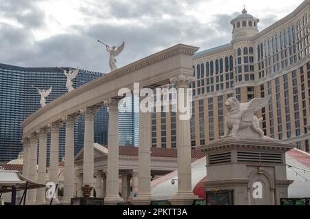 Winged lion, Greek pillars and angels with trumpets statues for Caesars Palace in front of the Bellagio Hotel and Casino in Las Vegas, Nevada USA Stock Photo