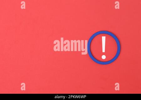 Exclamation mark drawn on red background with copy space Stock Photo