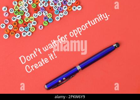 Red background written with DON'T WAIT FOR OPPORTUNITY. CREATE IT! Stock Photo