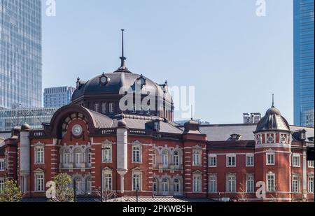 Historical Tokyo station building and modern skyscrapers around in Tokyo, Japan Stock Photo
