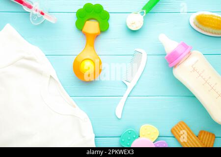 Baby milk with toys on grey background. Top view Stock Photo