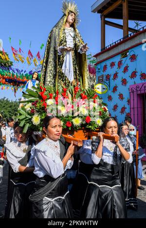 Mexican devotees carry the religious palanquin during during the Good Friday procession, on the Holy week, Oaxaca de Juárez , Mexico Stock Photo