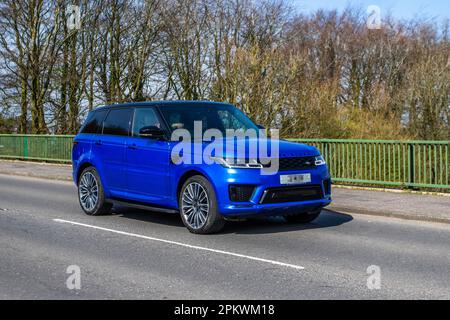 2020 Blue Land Rover Rrover Sport A-Bio Dyn Sdv6 A, SDV6 306 Commandshift Auto Start/Stop crossing motorway bridge in Greater Manchester, UK Stock Photo