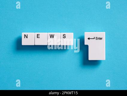 Online internet news. Broadcasting, publishing or watching the latest news concept. Computer keyboard keys with the word news. Stock Photo