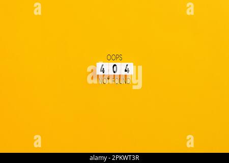 White letter blocks on yellow background with the website error message 404 not found. Stock Photo