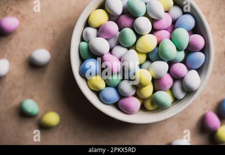 Close up of bowl of colorful mini chocolate eggs for easter. Stock Photo