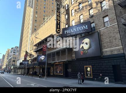 New York, USA. 09th Apr, 2023. Passers-by walk past the Majestic Theatre on Broadway. After more than 35 years, 'The Phantom of the Opera' will be performed for the last time in this theater on April 16, 2023. It is the longest running play in the history of the famous theater district. (to dpa: 'The last chandelier falls - end for 'Phantom of the Opera') Credit: Christian Fahrenbach/dpa/Alamy Live News Stock Photo