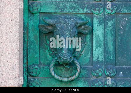 Bull's head detail of a bronze cathedral door in the historic town, Our Lady Mary Cathedral (Vor Frue Maria Domkirke), Ribe, Jutland, Denmark Stock Photo