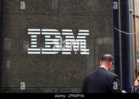 A businessman walks past the IBM building at 590 Madison Ave, New York in Midtown Manhattan. Stock Photo