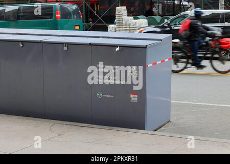 Rat proof containers approved under New York City's Clean Curbs program for the temporary storage of garbage bags until trash collection. Stock Photo