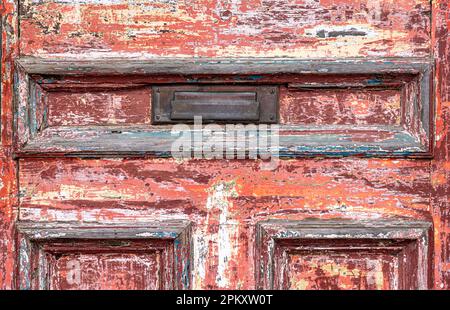 Detail of an old wooden door with layers of paint in Portsmouth, NH Stock Photo