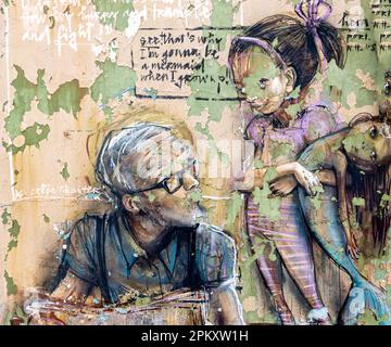 weathered graffiti mural on the exterior of a Portsmouth business Stock Photo