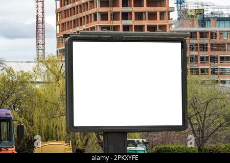 Outdoor advertising billboard mockup on building construction site, selective focus Stock Photo