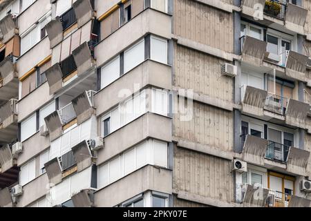 Brutalist architecture example, high apartment building skyscraper made of concrete with air conditioners on facade Stock Photo