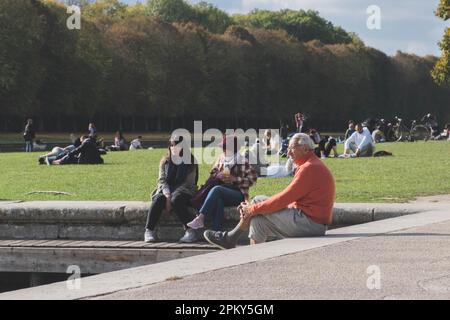 Calm day in the Versaille palace gardens - people hangin around by the lake Stock Photo
