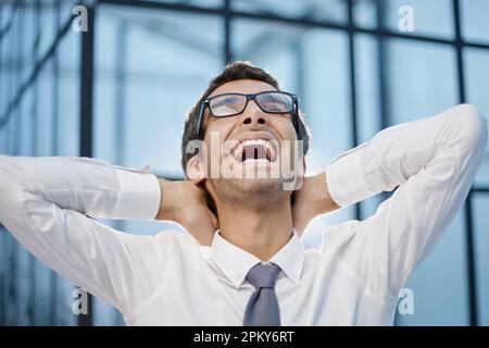 Millennial office worker standing in hallway clenched fists feel overjoyed celebrate career advancement Stock Photo