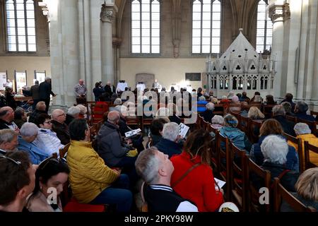 Magdeburg, Germany. 10th Apr, 2023. Guests watch the festive service in the cathedral for the inauguration of five newly cast bells for the cathedral bell ringing. Credit: Peter Gercke/dpa-Zentralbild/dpa/Alamy Live News Stock Photo