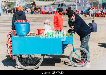 Kathmandu,Nepal - Jan 14,2023 : Street Seller waiting for Customer in Tudikhel Kathmandu. Life of Nepali Street Seller, Street Market Nepal. Stock Photo