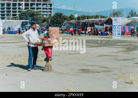 Kathmandu,Nepal - Jan 14,2023 : Pani Puri Seller waiting for Customer in Tudikhel. Life of Nepali Street Seller, Street Market Nepal. Stock Photo