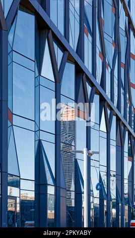 A faceted glass façade replaces a demolished wall at the former Arbuckle Sugar Refinery, 10 Jay Street, Brooklyn, on the East River. Stock Photo