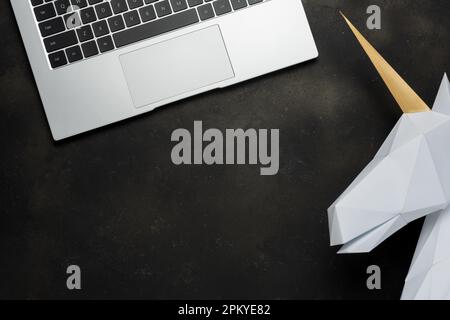 Top view of laptop on black background. Flat lay, top view office table desk. Stock Photo