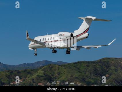 Bombardier Challenger 300 with registration N784QS shown moments before landing at Hollywood Burbank Airport. Stock Photo