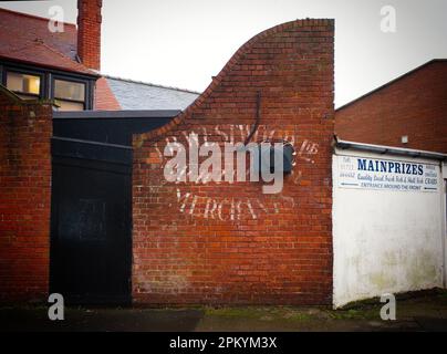 Hidden painted on brick walll sign in Scarborough Stock Photo