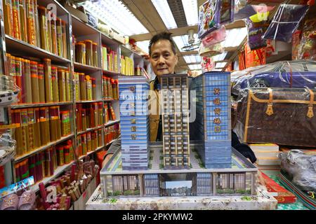 To Chin-sung, Owner of Chun Shing Hong paper offering shop in Sai Ying Pun says Office tower paper effigies is the most popular paper offerings this year to pay tribute to ancestors on the day of Ching Ming Festival (April 05).  02APR23. SCMP/ Dickson Lee Stock Photo