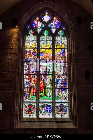 A stained glass window depicting Joan of Arc in St Ronan Church, Locronan, Brittany, France Stock Photo