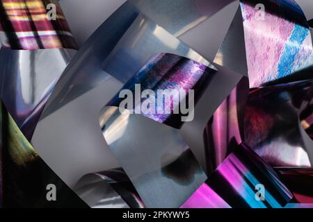 Bright iridescent ornament on rolls of thin holographic foil Stock Photo