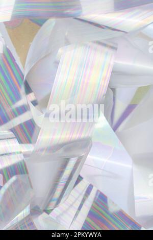 From above hip of thin strips of shiny holographic foil Stock Photo