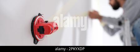 Builder using professional measuring device for marks Stock Photo