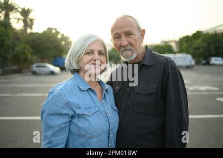 Senior man and woman looking at camera Stock Photo