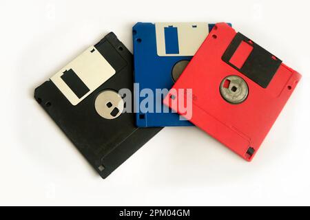 Three floppy disk storage. Red, black and blue. vintage Stock Photo